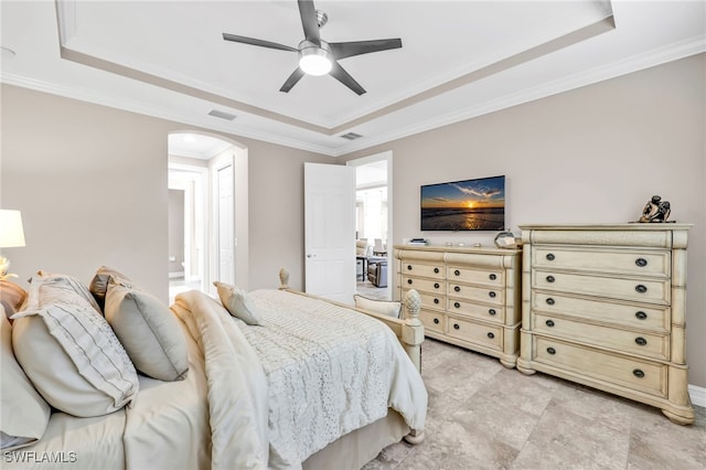 14482 Tuscany Pointe Trl, Naples, FL 34120 - bedroom with a tray ceiling, arched walkways, crown molding, and a ceiling fan