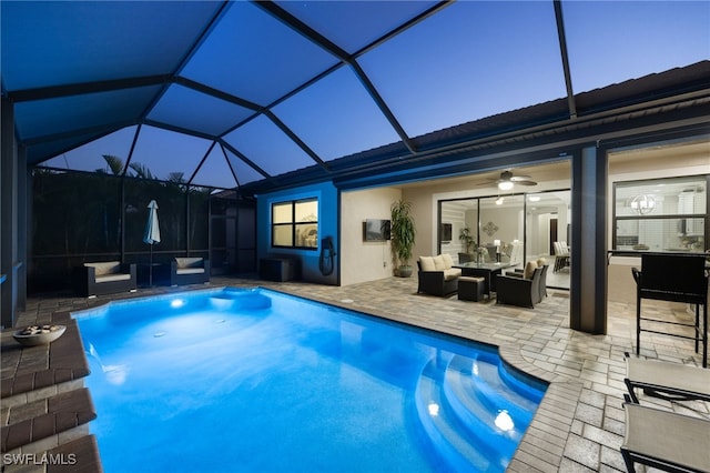 14482 Tuscany Pointe Trl, Naples, FL 34120 - outdoor pool featuring outdoor lounge area, a patio area, a ceiling fan, and a lanai
