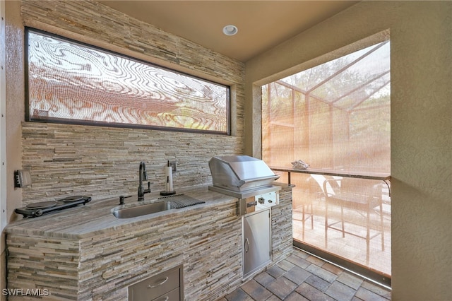 14482 Tuscany Pointe Trl, Naples, FL 34120 - view of patio featuring grilling area, a sink, and an outdoor kitchen