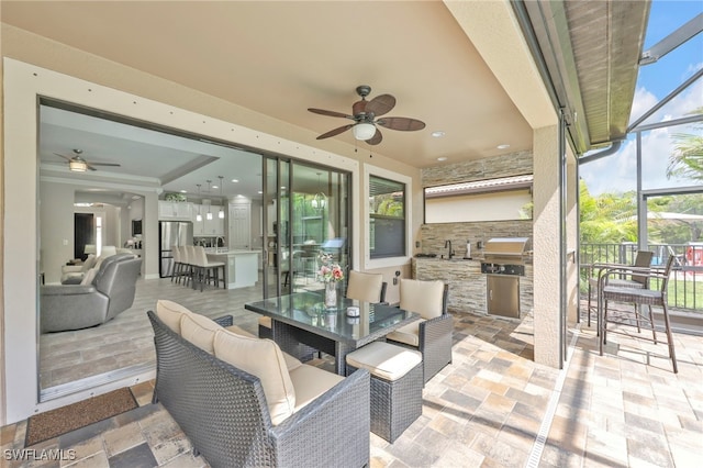 14482 Tuscany Pointe Trl, Naples, FL 34120 - view of patio / terrace featuring area for grilling, a ceiling fan, outdoor dining space, and a lanai