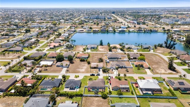 view of property location with nearby suburban area and a large body of water