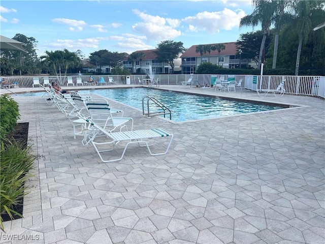 5045 Cedar Springs Dr Unit 104, Naples, FL 34110 - pool with a patio and fence