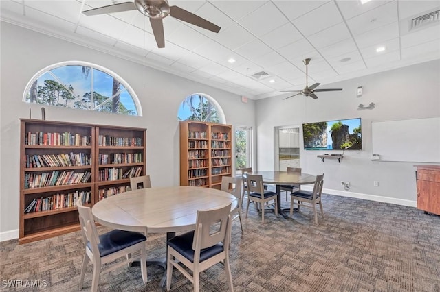 5045 Cedar Springs Dr Unit 104, Naples, FL 34110 - carpeted dining area featuring ceiling fan, baseboards, a towering ceiling, and visible vents