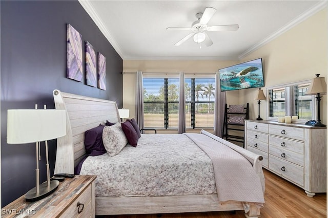 1259 Carpazi Ct Unit 302, Naples, FL 34105 - bedroom with ceiling fan, crown molding, and light wood finished floors