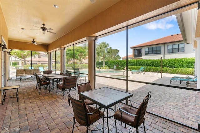 1259 Carpazi Ct Unit 302, Naples, FL 34105 - sunroom featuring a wealth of natural light, ceiling fan, and outdoor dining area