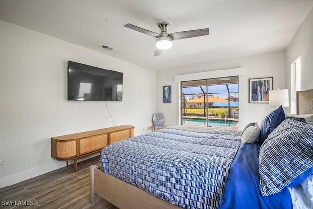 20640 Porthole Ct, Estero, FL 33928 - bedroom with multiple windows, wood finished floors, baseboards, and access to outside