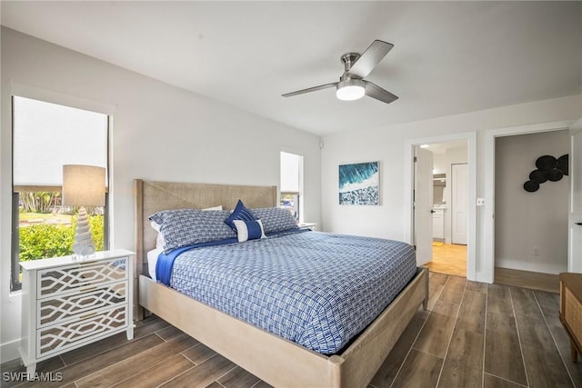 20640 Porthole Ct, Estero, FL 33928 - bedroom with dark wood-style floors and ceiling fan