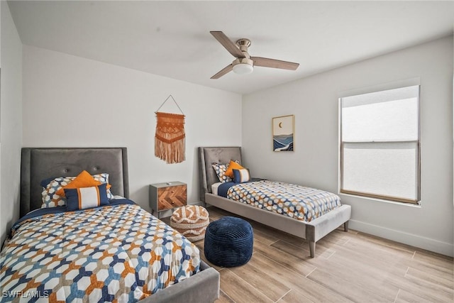 20640 Porthole Ct, Estero, FL 33928 - bedroom featuring baseboards, a ceiling fan, and wood finished floors