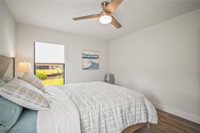 20640 Porthole Ct, Estero, FL 33928 - bedroom featuring baseboards, wood finished floors, and ceiling fan