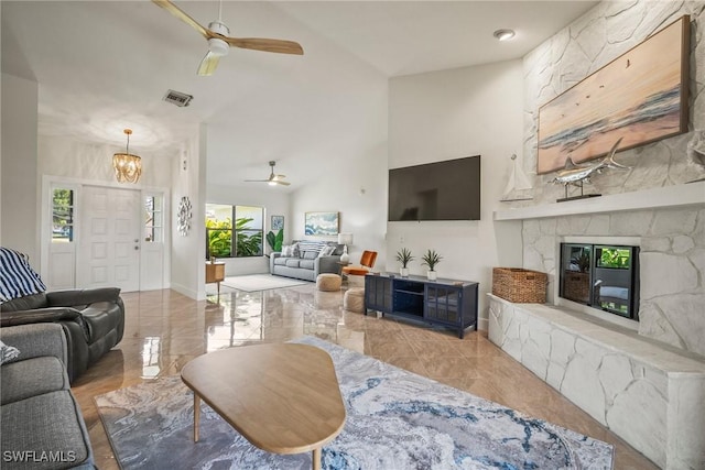 20640 Porthole Ct, Estero, FL 33928 - living room with high vaulted ceiling, marble finish floor, visible vents, and ceiling fan with notable chandelier