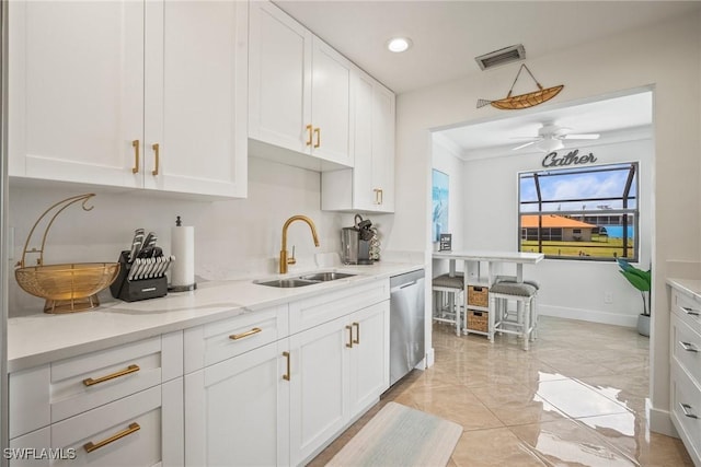 20640 Porthole Ct, Estero, FL 33928 - kitchen featuring white cabinets, light stone counters, dishwasher, visible vents, and a sink
