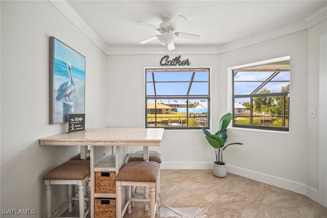 20640 Porthole Ct, Estero, FL 33928 - dining room with a ceiling fan, baseboards, and crown molding