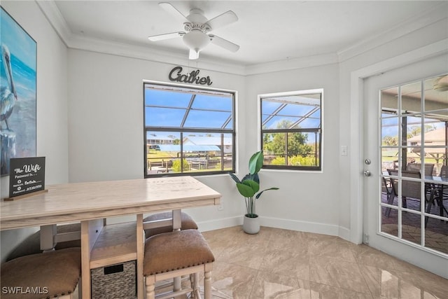 20640 Porthole Ct, Estero, FL 33928 - dining area featuring crown molding, baseboards, and ceiling fan