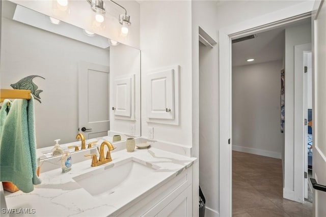 20640 Porthole Ct, Estero, FL 33928 - bathroom with baseboards, visible vents, and vanity