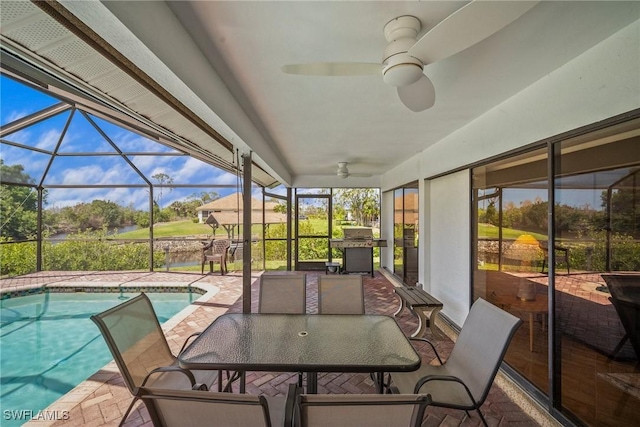 20640 Porthole Ct, Estero, FL 33928 - sunroom featuring a ceiling fan and a swimming pool