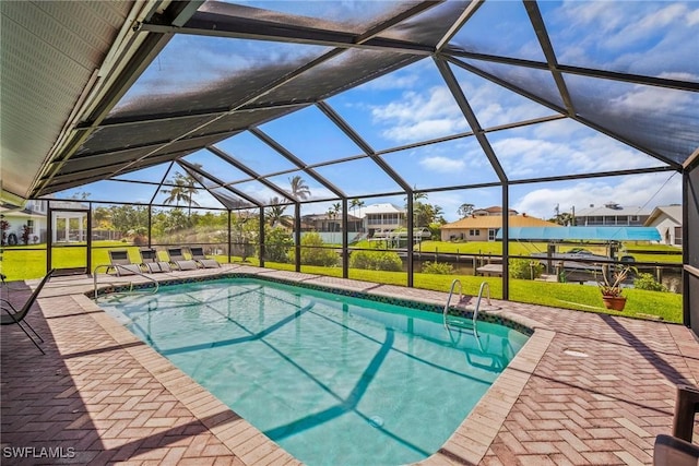 20640 Porthole Ct, Estero, FL 33928 - outdoor pool with a yard, a residential view, a patio area, and glass enclosure