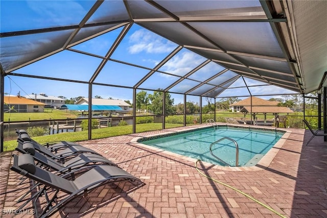 20640 Porthole Ct, Estero, FL 33928 - pool featuring glass enclosure and a patio area