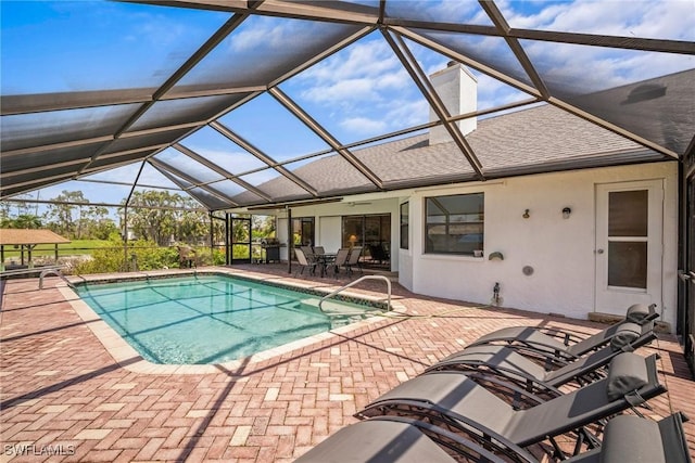 20640 Porthole Ct, Estero, FL 33928 - outdoor pool with a patio area, a lanai, outdoor dining space, and ceiling fan