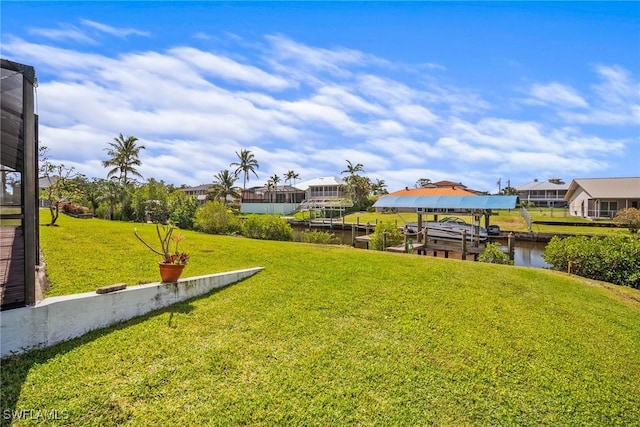 20640 Porthole Ct, Estero, FL 33928 - view of yard with a boat dock, a residential view, boat lift, and a water view