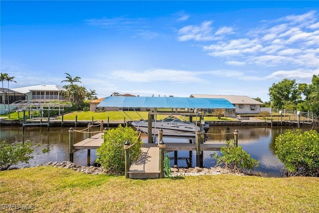 20640 Porthole Ct, Estero, FL 33928 - dock area with a lawn, boat lift, and a water view