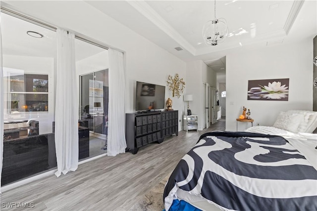 3007 8th St W, Lehigh Acres, FL 33971 - bedroom featuring wood finished floors and a chandelier