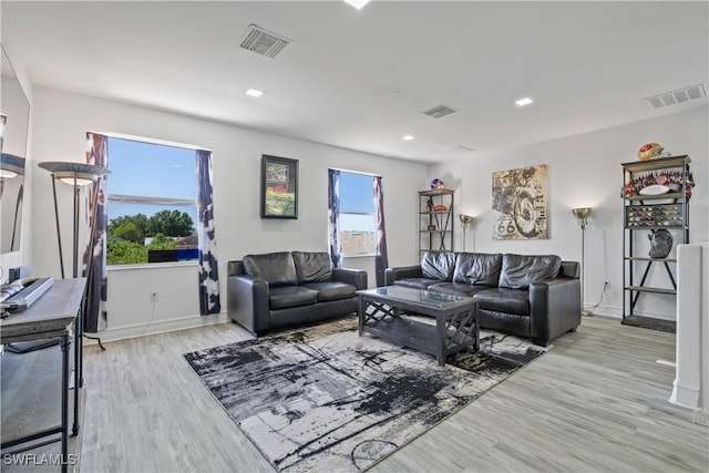 3007 8th St W, Lehigh Acres, FL 33971 - living area featuring light wood-style flooring, baseboards, and recessed lighting