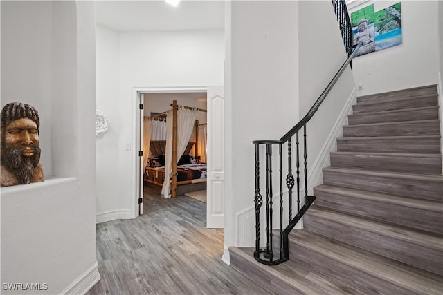 3007 8th St W, Lehigh Acres, FL 33971 - stairs with wood finished floors and baseboards