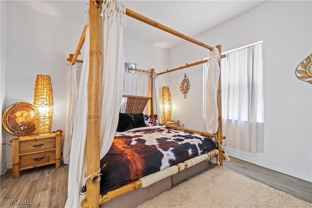 3007 8th St W, Lehigh Acres, FL 33971 - bedroom with wood finished floors and baseboards