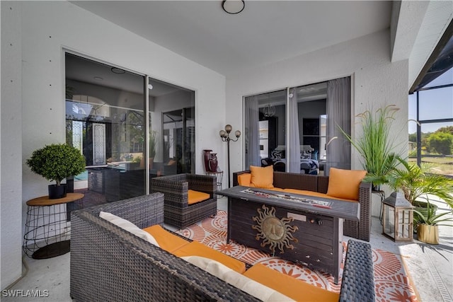 3007 8th St W, Lehigh Acres, FL 33971 - view of patio featuring a lanai and an outdoor living space with a fire pit