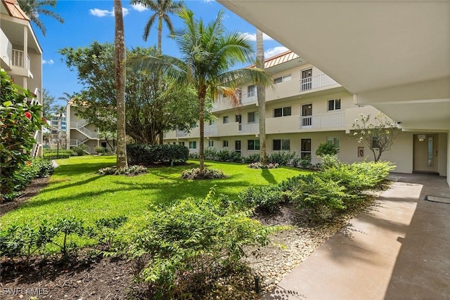 surrounding community with a lawn