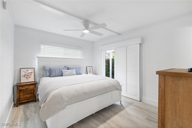 bedroom with light wood-style floors, access to outside, baseboards, and ceiling fan
