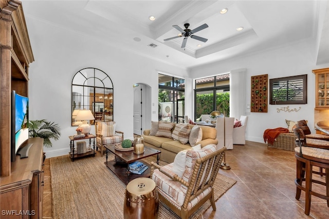tiled living room featuring visible vents, ornamental molding, baseboards, recessed lighting, and a ceiling fan