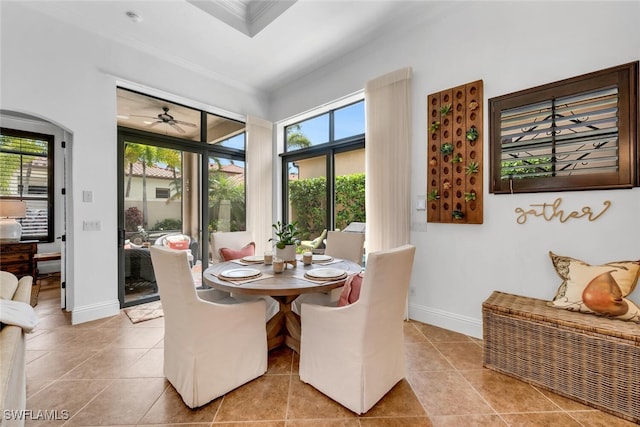 7996 Cordoba Pl, Naples, FL 34113 - dining space featuring ornamental molding, healthy amount of natural light, tile patterned floors, ceiling fan, and baseboards