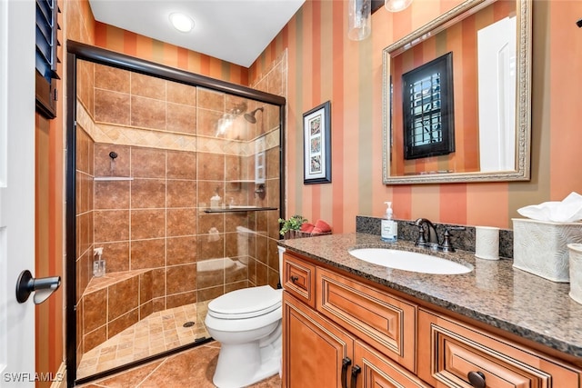 7996 Cordoba Pl, Naples, FL 34113 - full bath featuring vanity, a shower stall, toilet, wallpapered walls, and tile patterned floors