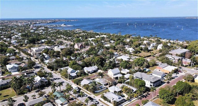aerial overview of property's location with a large body of water and nearby suburban area
