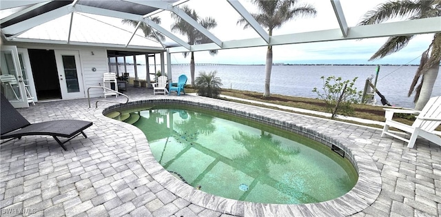 outdoor pool with a patio, a water view, and a lanai