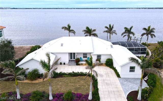 aerial view of property and surrounding area featuring a large body of water