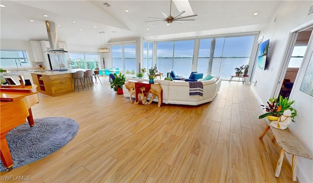 living room featuring ceiling fan, light wood-style flooring, and recessed lighting