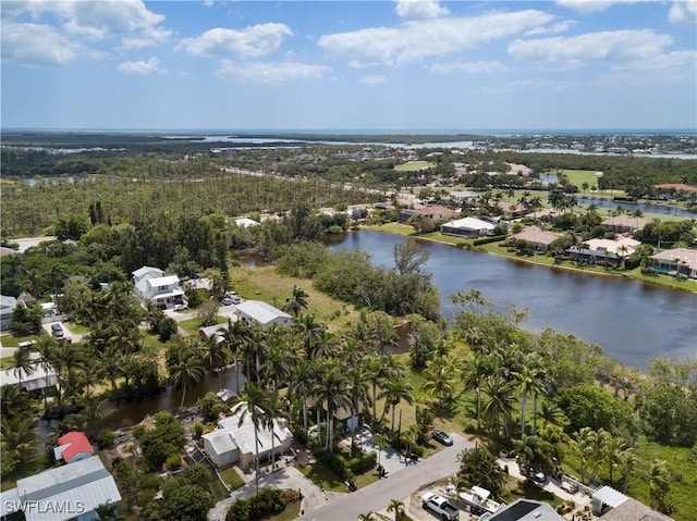 bird's eye view featuring a residential view and a water view