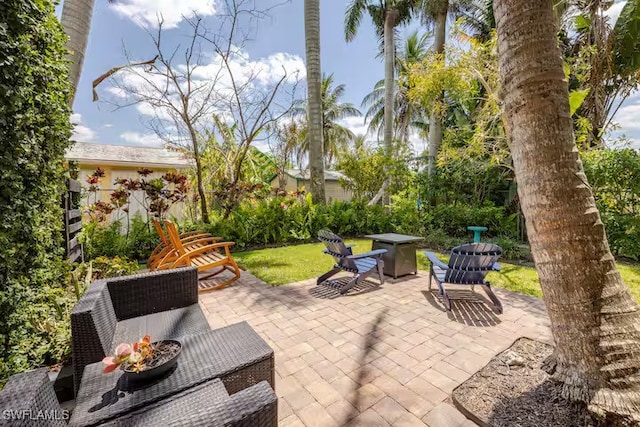view of patio / terrace with an outdoor fire pit