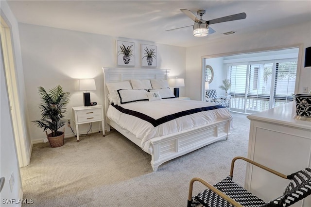 bedroom featuring a ceiling fan, light carpet, access to outside, and baseboards