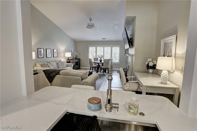 living room featuring vaulted ceiling