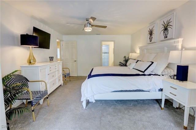 bedroom with ceiling fan and light carpet