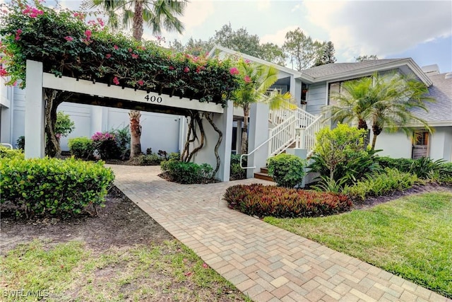 view of front of house featuring stairway