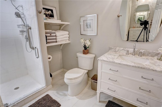 bathroom featuring baseboards, a shower stall, toilet, and vanity