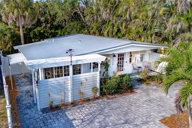 view of front of house featuring fence