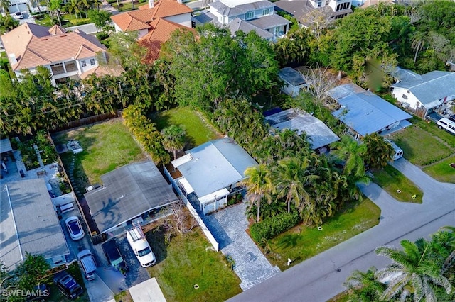 birds eye view of property with a residential view