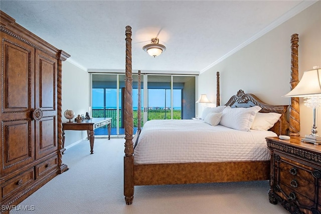 7515 Pelican Bay Blvd Unit 7B, Naples, FL 34108 - carpeted bedroom featuring crown molding, access to outside, and baseboards