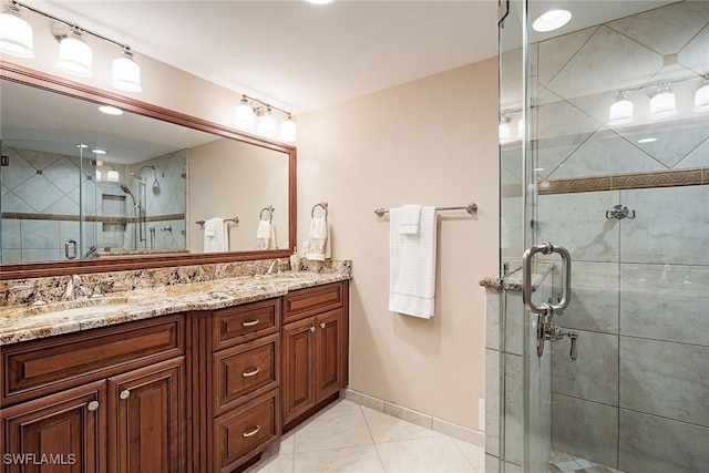 7515 Pelican Bay Blvd Unit 7B, Naples, FL 34108 - full bath featuring baseboards, a stall shower, double vanity, and a sink