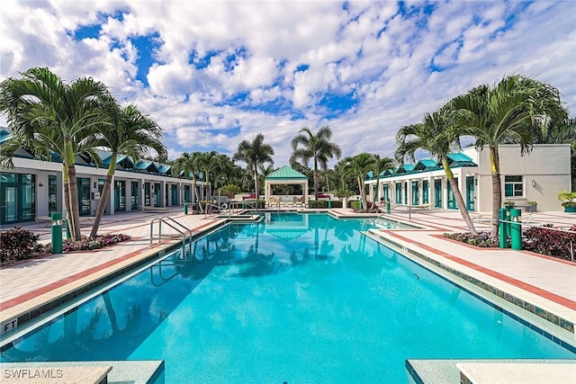 7515 Pelican Bay Blvd Unit 7B, Naples, FL 34108 - pool featuring a gazebo and a patio area